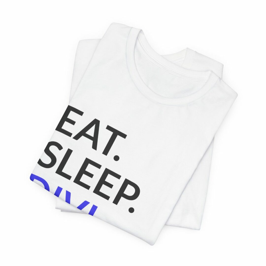 Folded white t-shirts with "EAT. SLEEP." text.