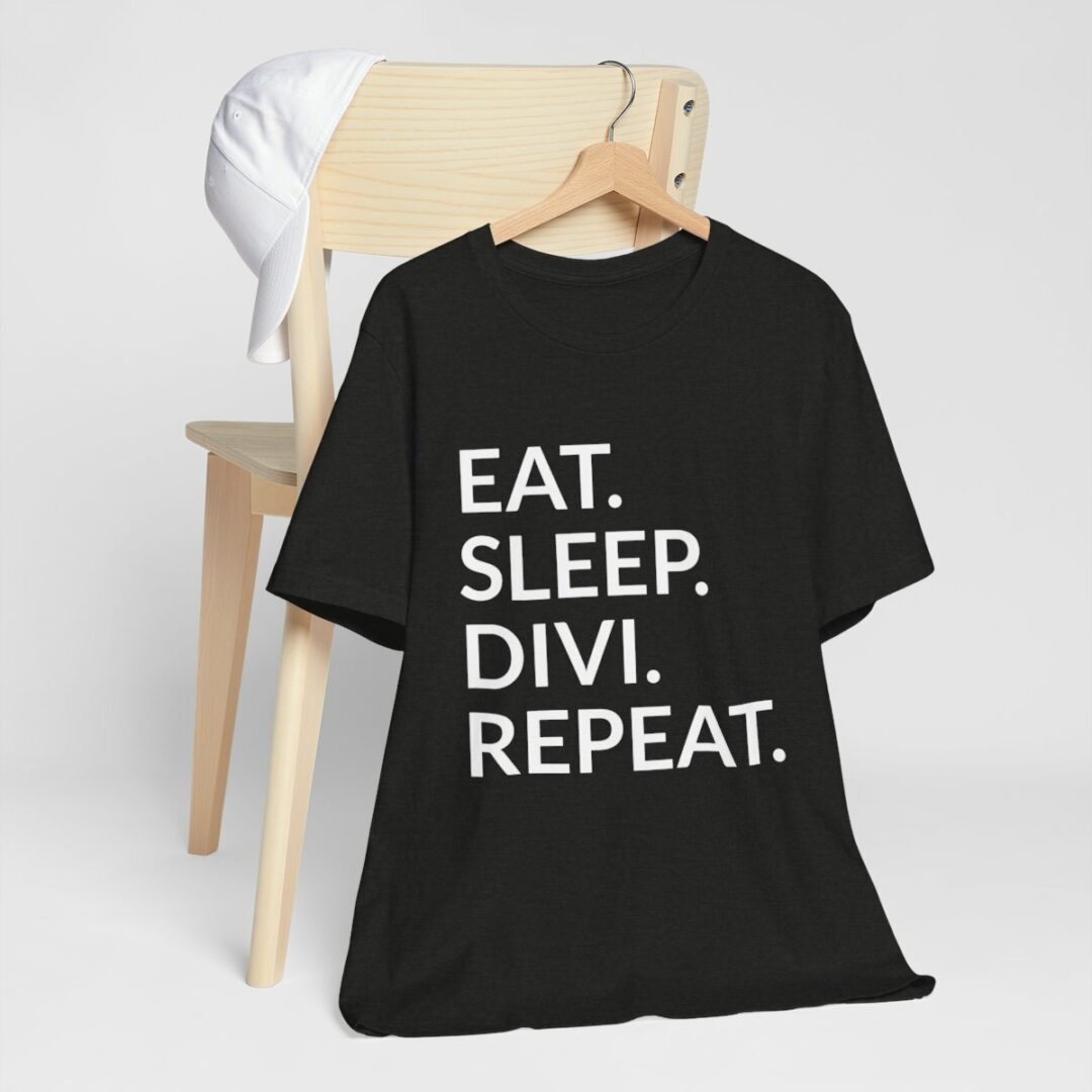 Black t-shirt with "EAT. SLEEP. DIVI. REPEAT." slogan.