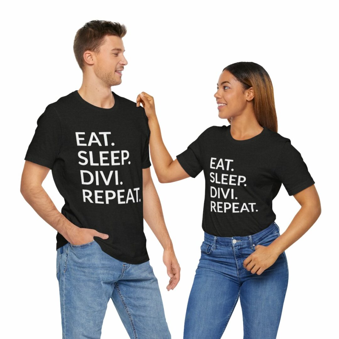 Two people wearing matching slogan t-shirts.